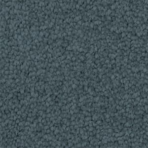 A close up of a blue carpet texture.