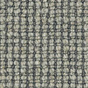 A close up of a gray carpet with a striped pattern.