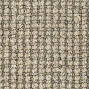 A close up of a carpet with a striped pattern.