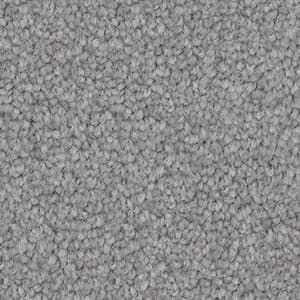 A close up of a gray carpet texture.