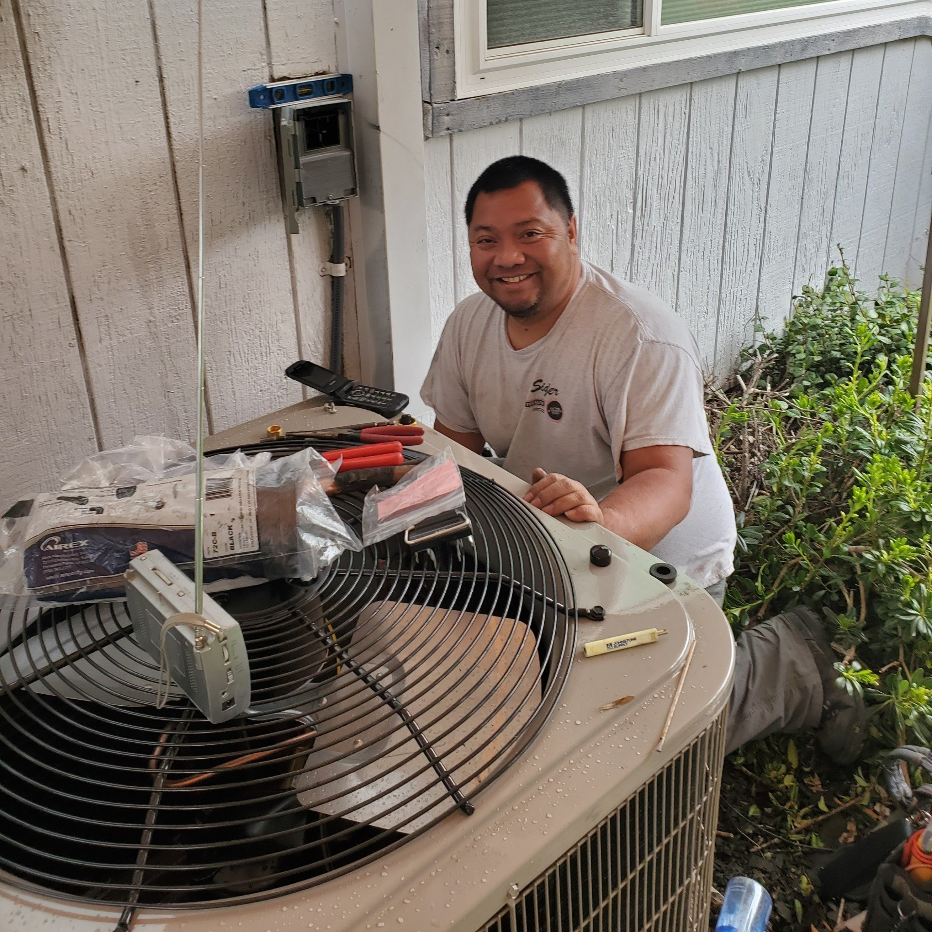 Technician Repairing Air Conditioner — Sacramento, CA — Pavlo Heating & Cooling