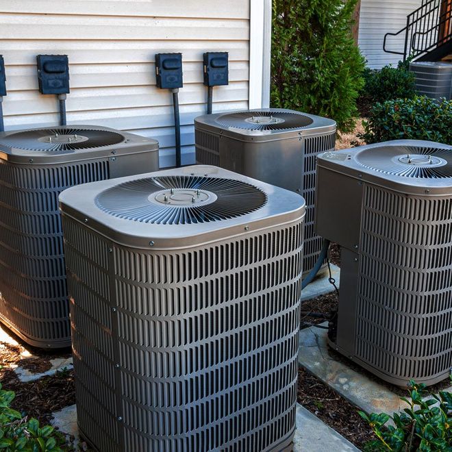 Four Apartment Air Conditioners Outside — Sacramento, CA — Pavlo Heating & Cooling