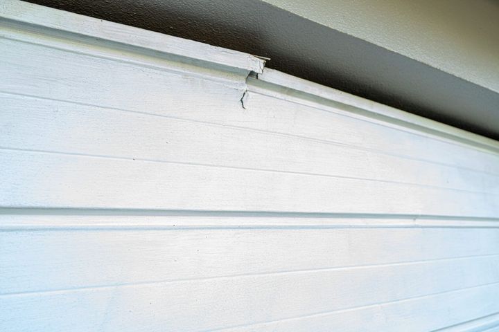 Cracked white garage door