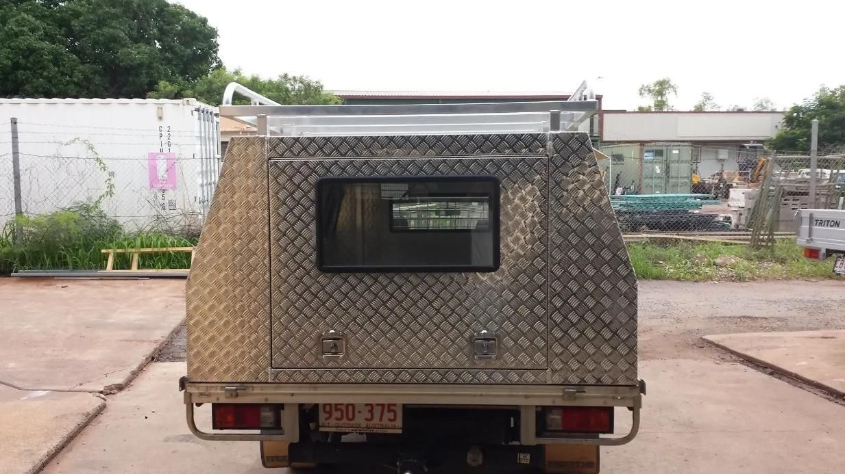 A Truck with A Canopy on Top of It Is Parked in A Parking Lot — MBB Toolbox In Winnellie, NT