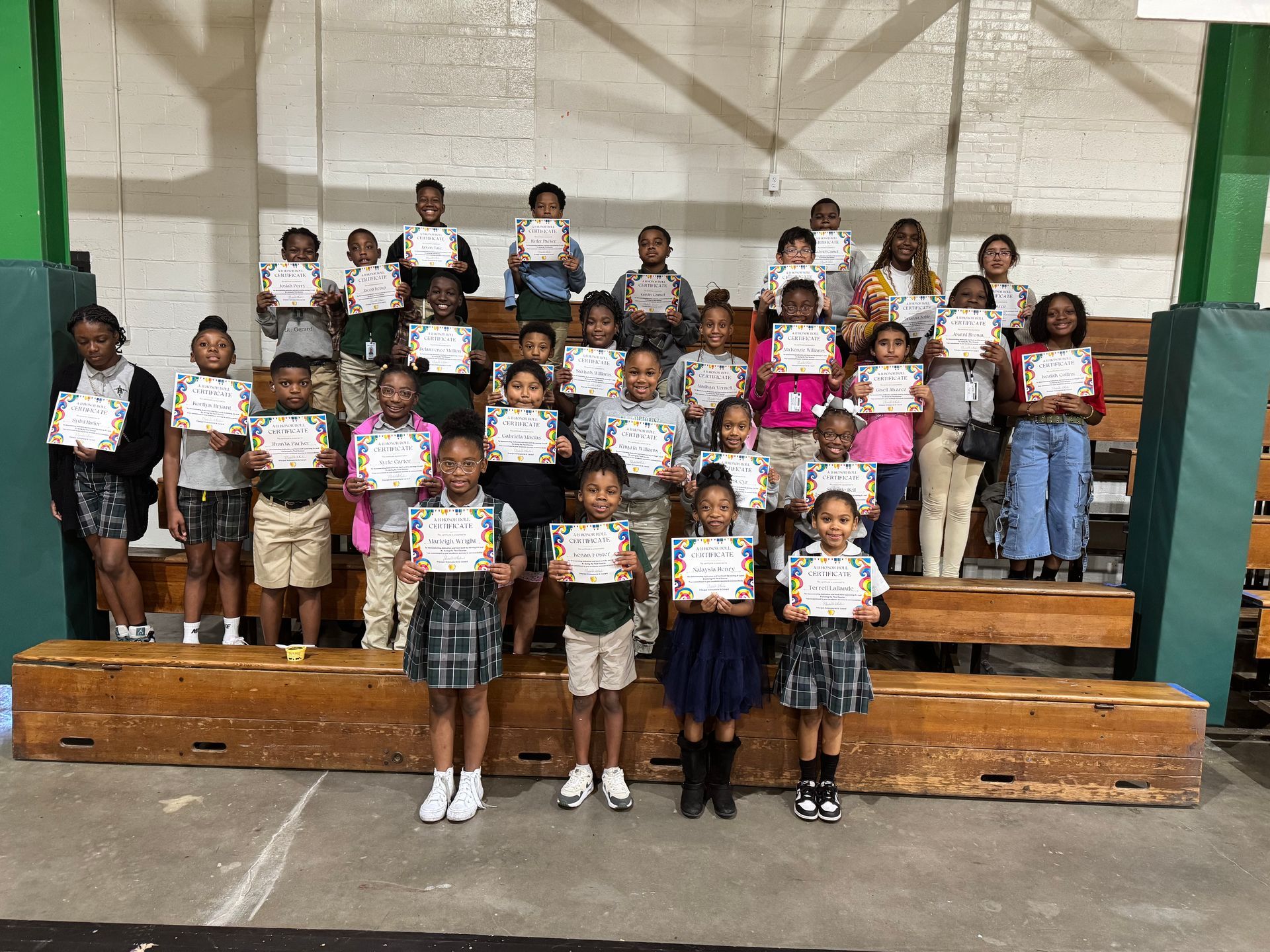 A woman in a blue jacket is giving a tablet to another woman