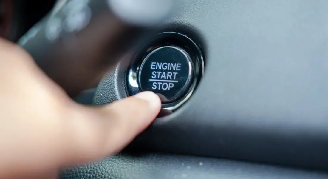 Finger about to push Engine Start and Stop button on vehicle dashboard | Bertinis German Motors