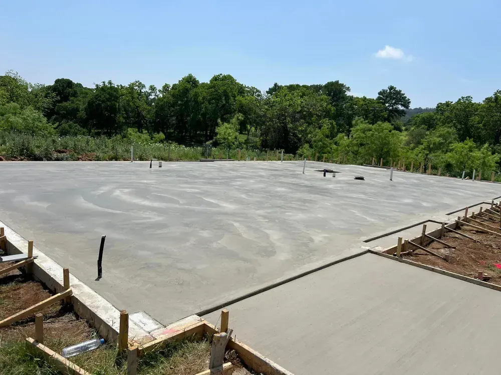 A concrete foundation is being built for a house.