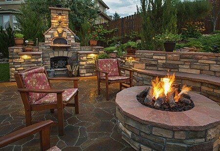House For Sale — Backyard Fire Pit With Pillowed Chairs in Montgomery, AL