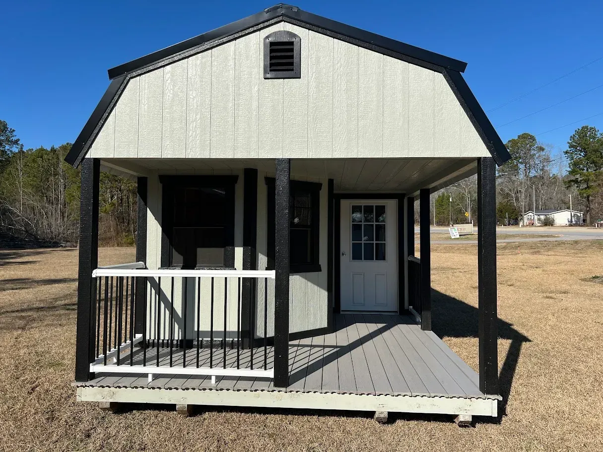 A small house with a porch and a window
