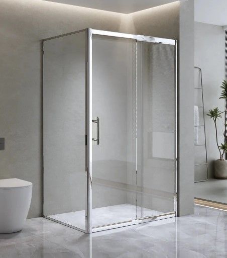 frameless shower with a marble floor