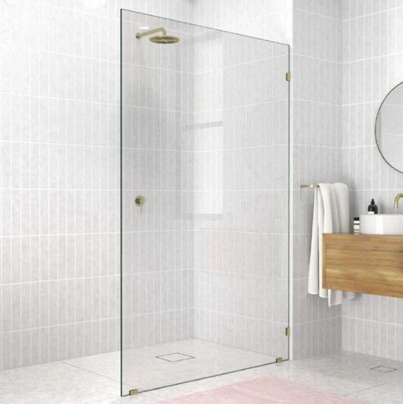walk in shower with white grey tiles