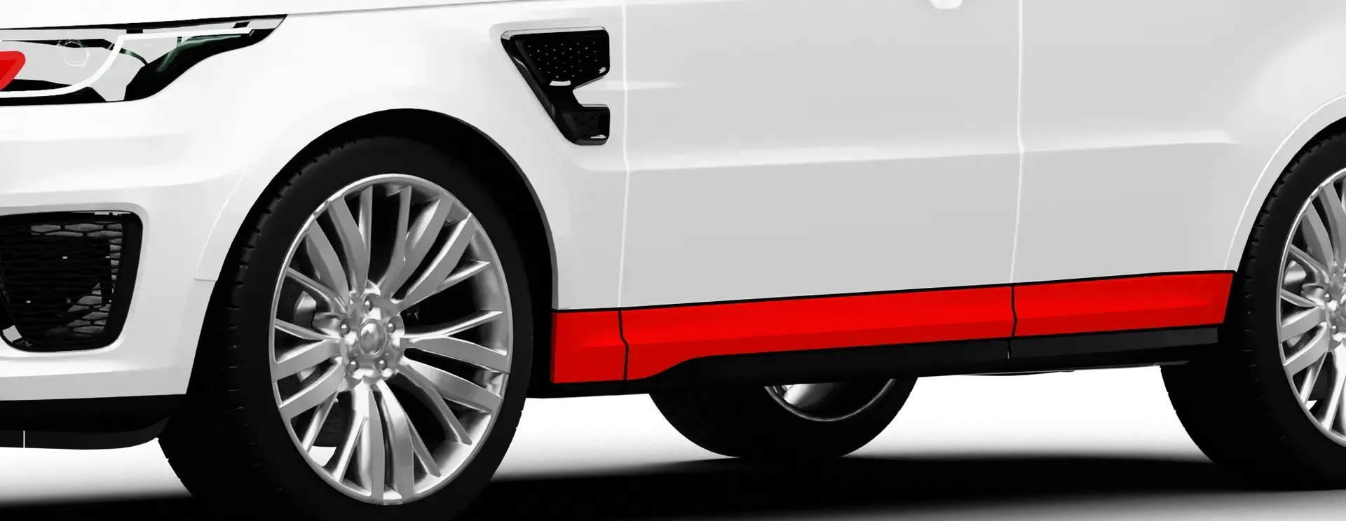 Paint protection film on car rocker panels showing protected areas.
