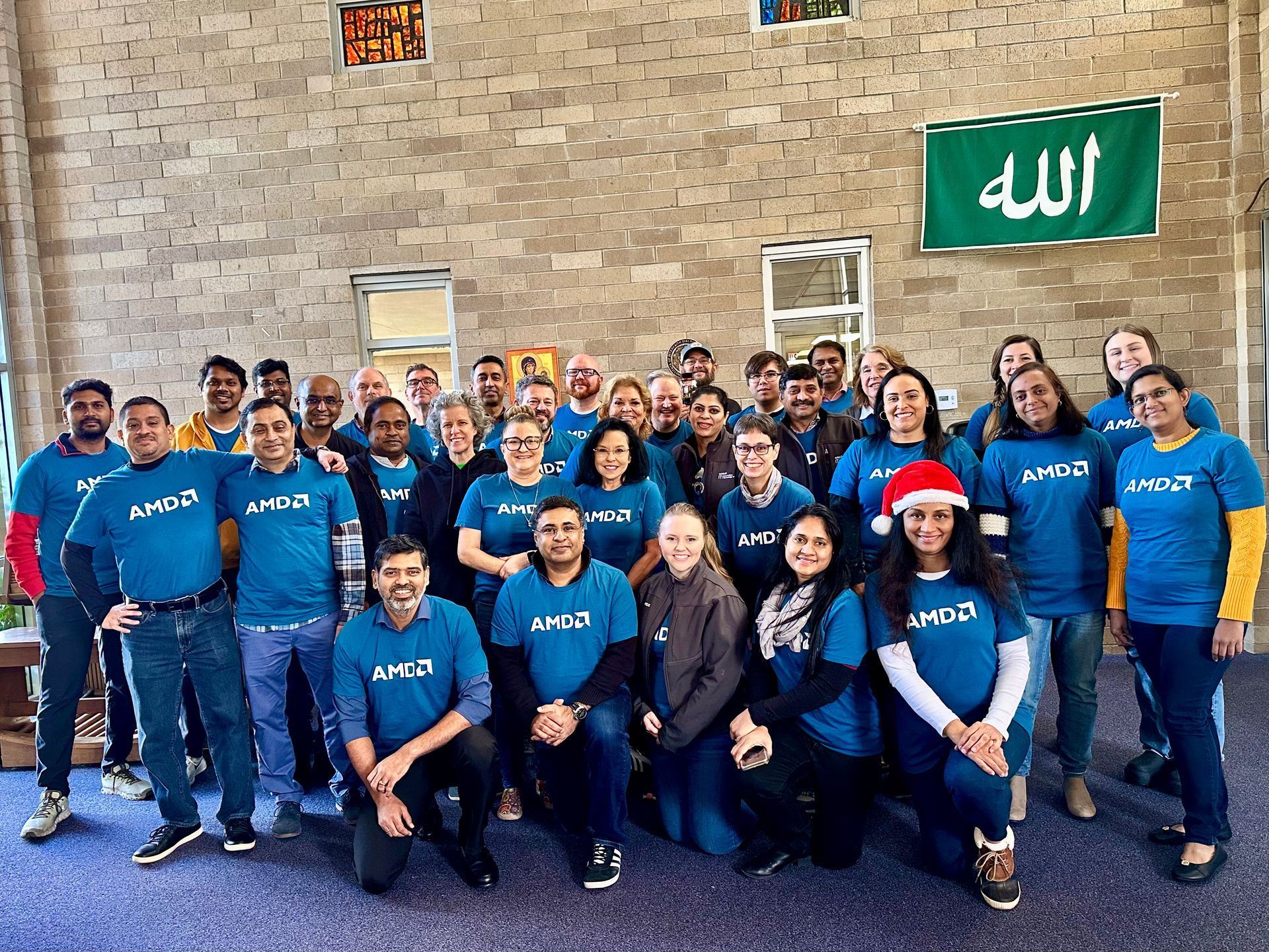 Group of volunteers posing in blue shirts At Austin State Hospital