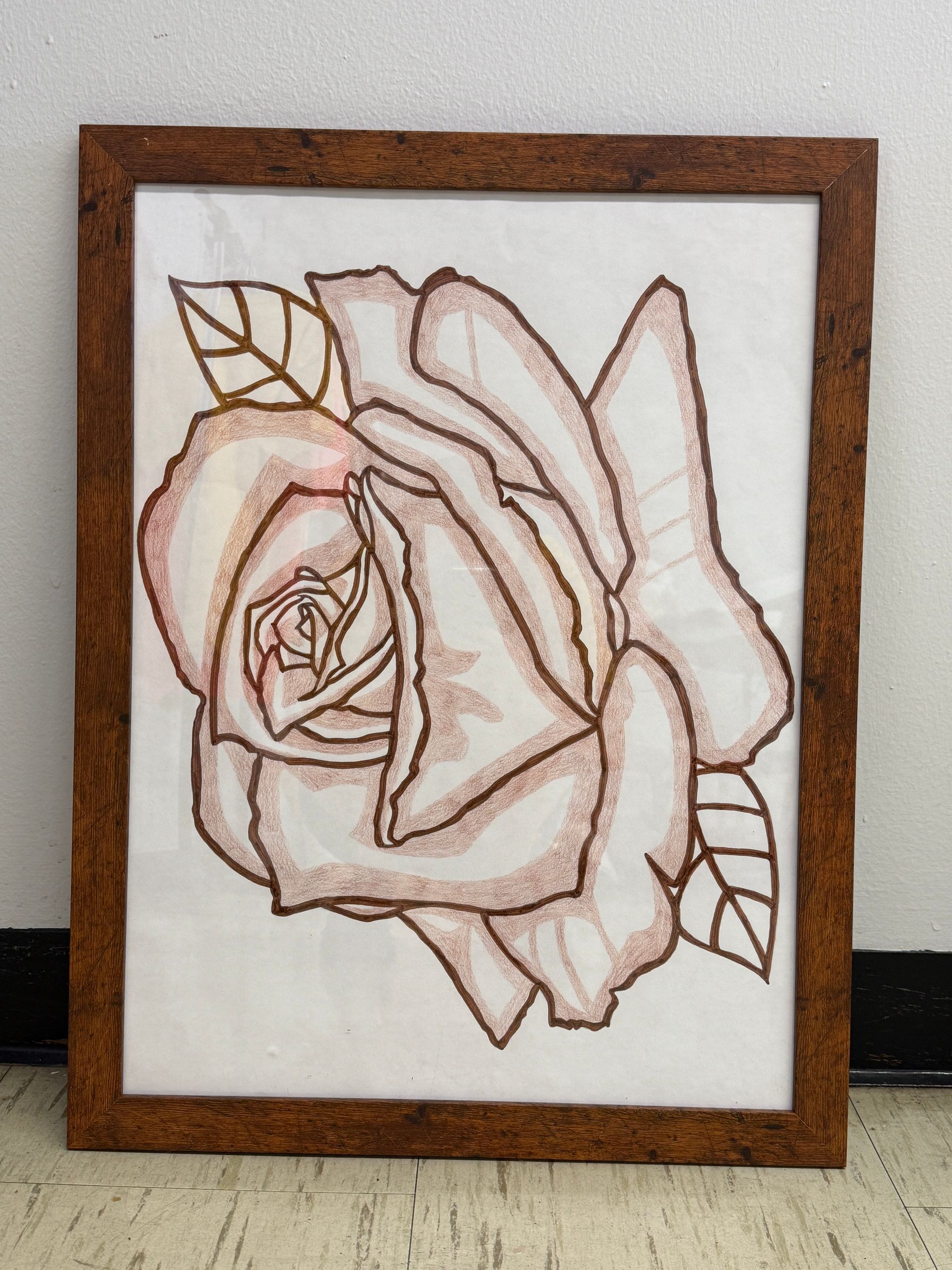 Wooden-framed art: a rose illustration in light brown on a white background.