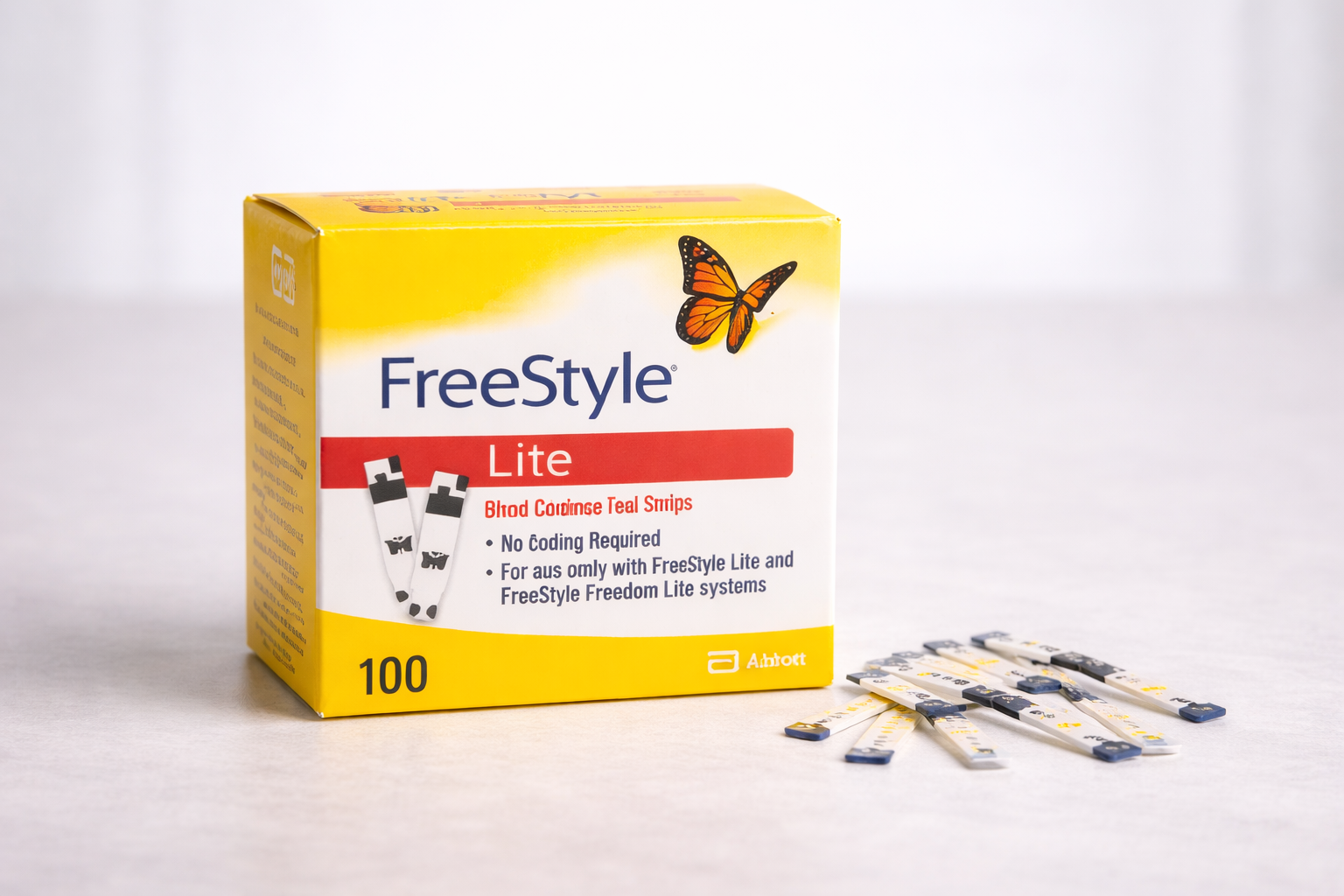 Person holding a small test strip, preparing to use a glucose meter on a wooden table.