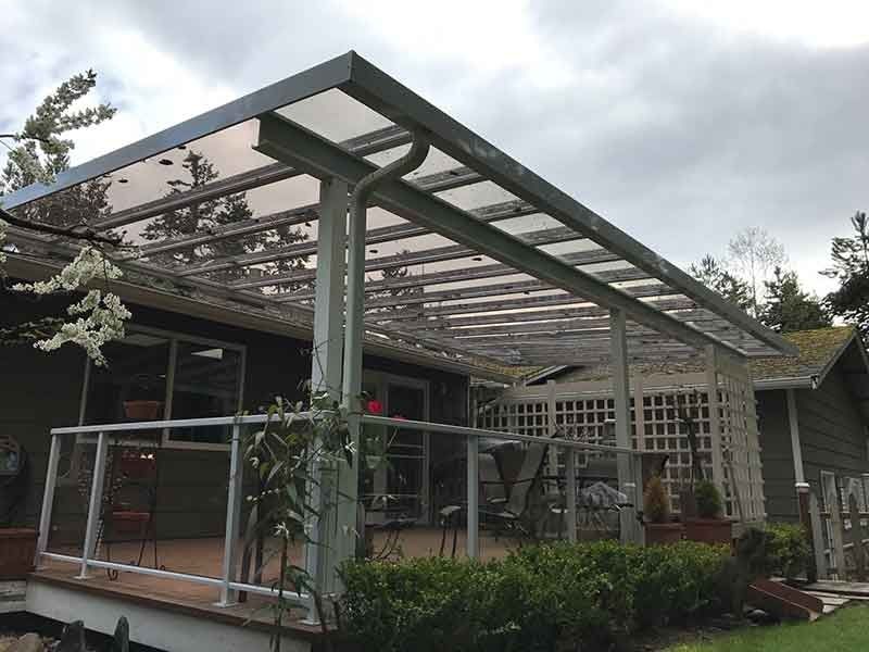 A House With A Covered Deck And A Glass Roof — Kirkland, WA — Action Installations LLC
