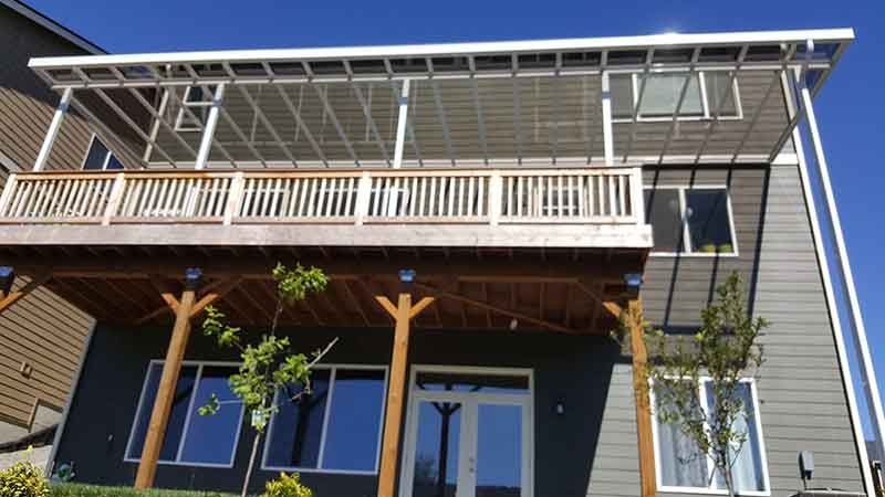 A House With A Large Deck And A Covered Porch — Kirkland, WA — Action Installations LLC
