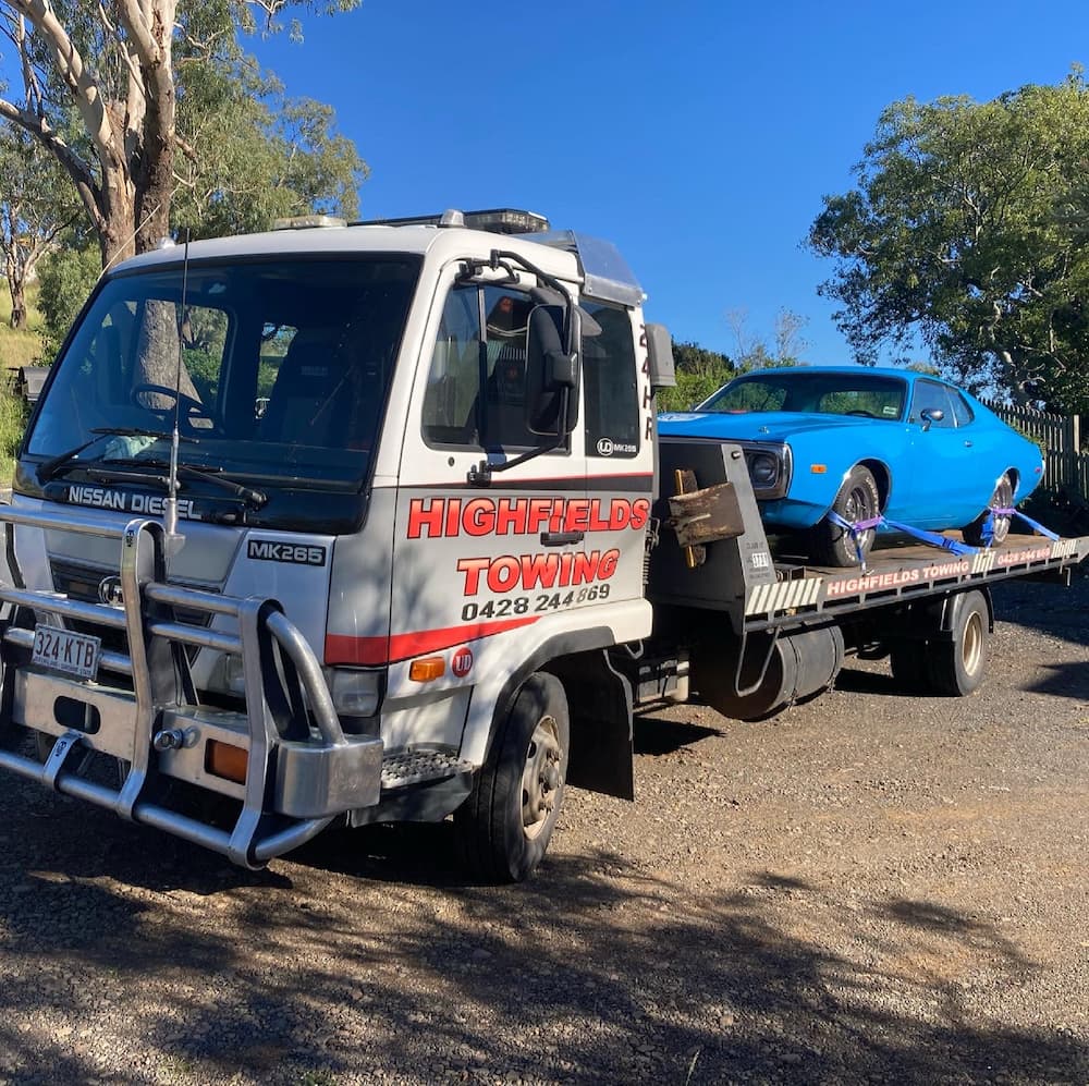Tow Truck Loaded with Blue Old Car —  Highfields Towing in Highfields, QLD