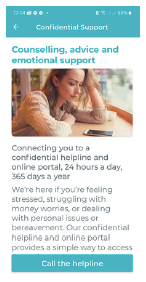 a woman is sitting at a table with her hand on her head .