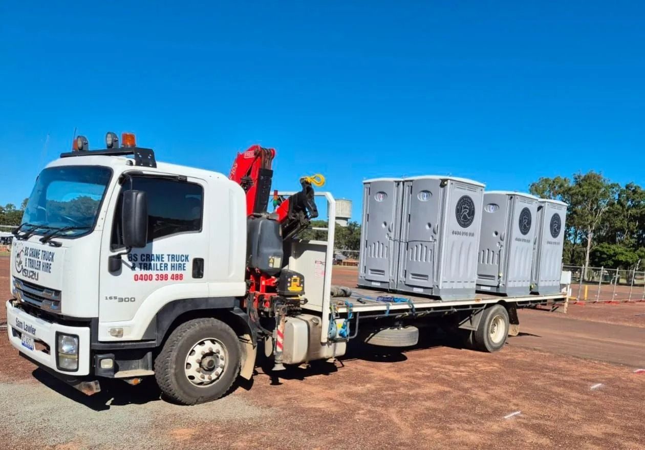 White Truck Carrying Several Portable Toilets — Royal Flush Luxury Toilet, Portaloo & Shower Hire in Gympie, QLD
