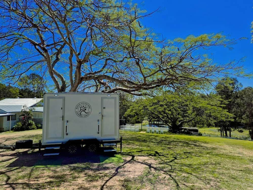 Portable Restroom Trailer Under a Tree — Royal Flush Luxury Toilet, Portaloo & Shower Hire in Maryborough, QLD