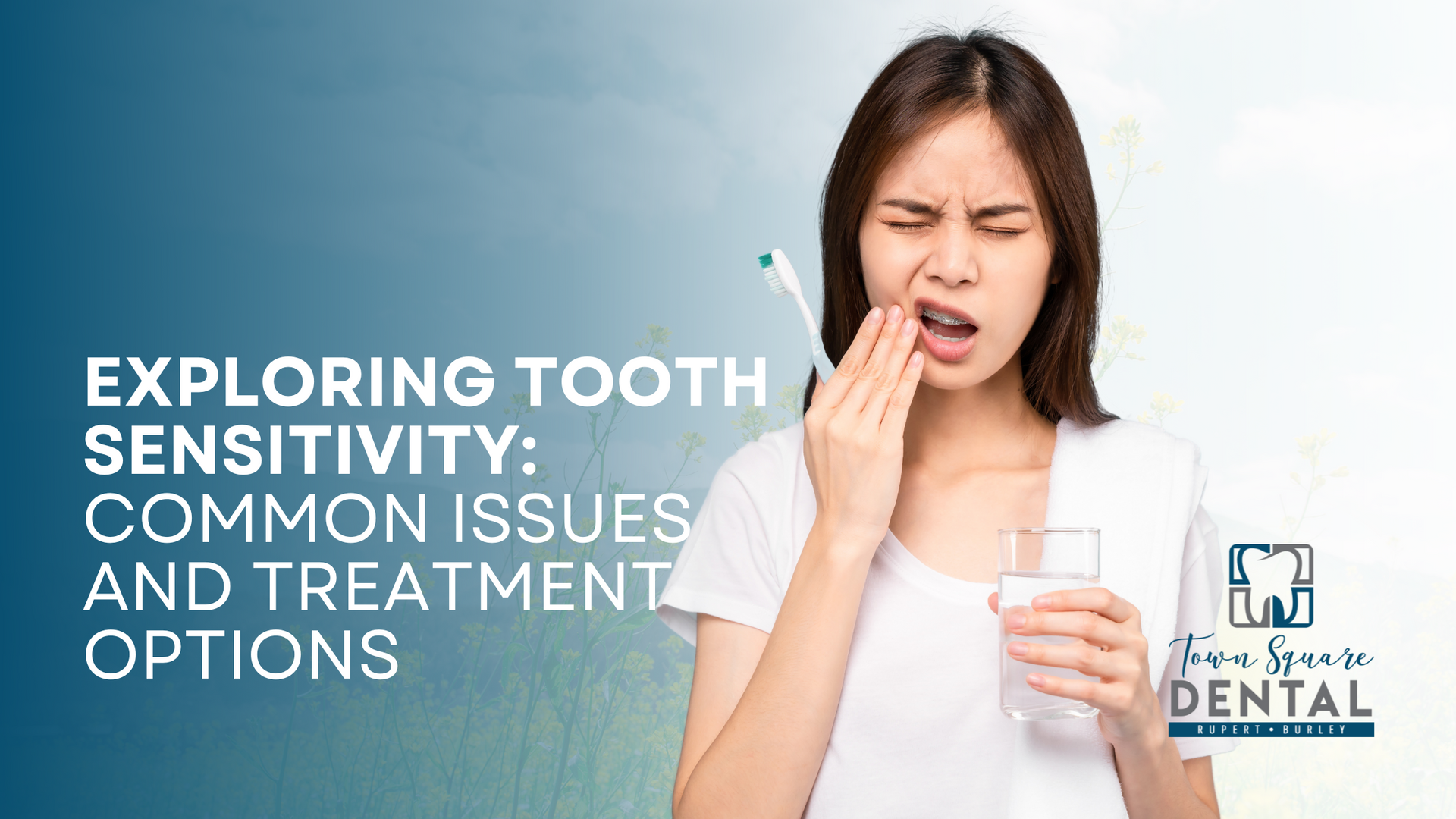 A woman is brushing her teeth and holding a glass of water.