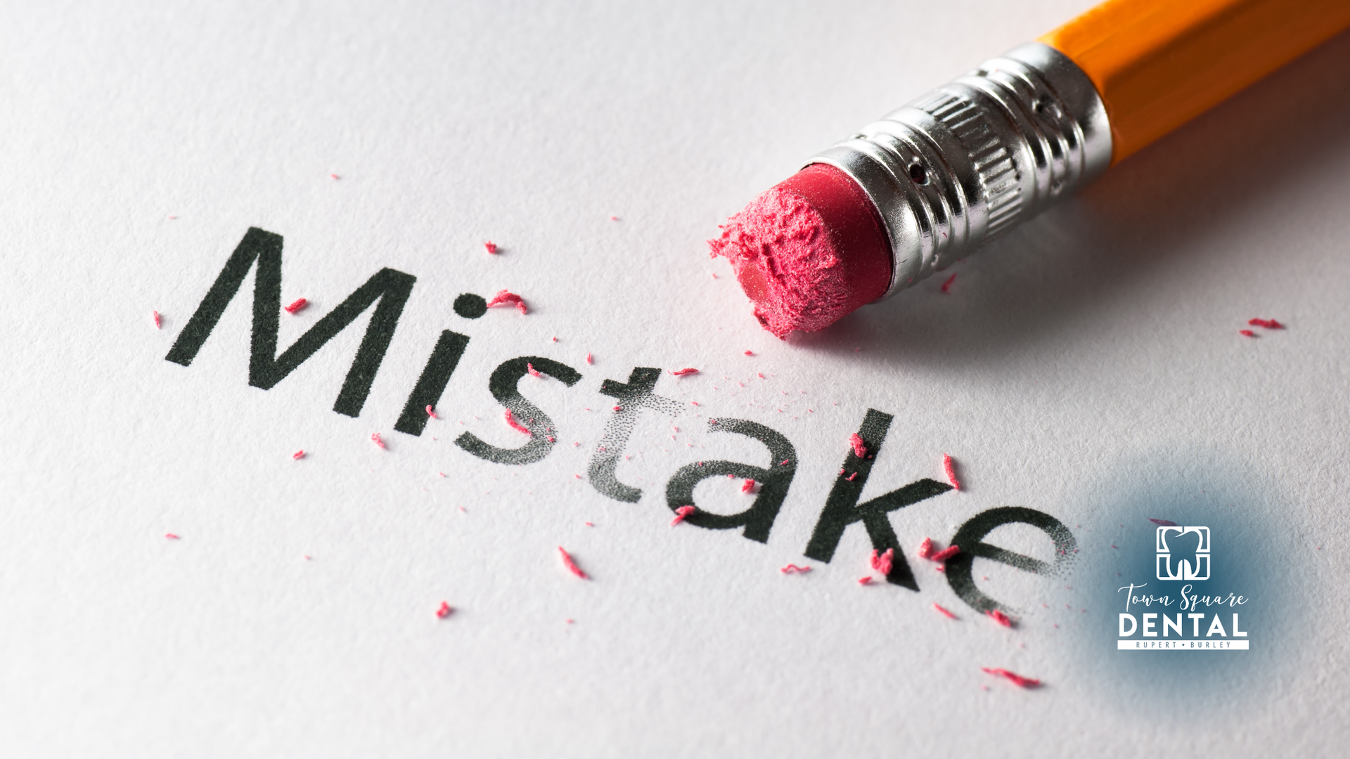 Pencil erasing the word