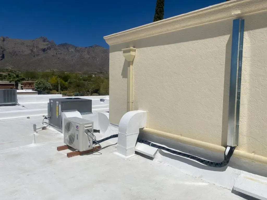 A white roof with a ventilation system on it