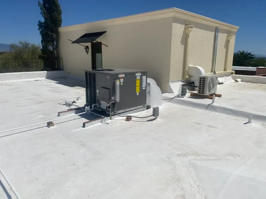 A white roof with a building in the background