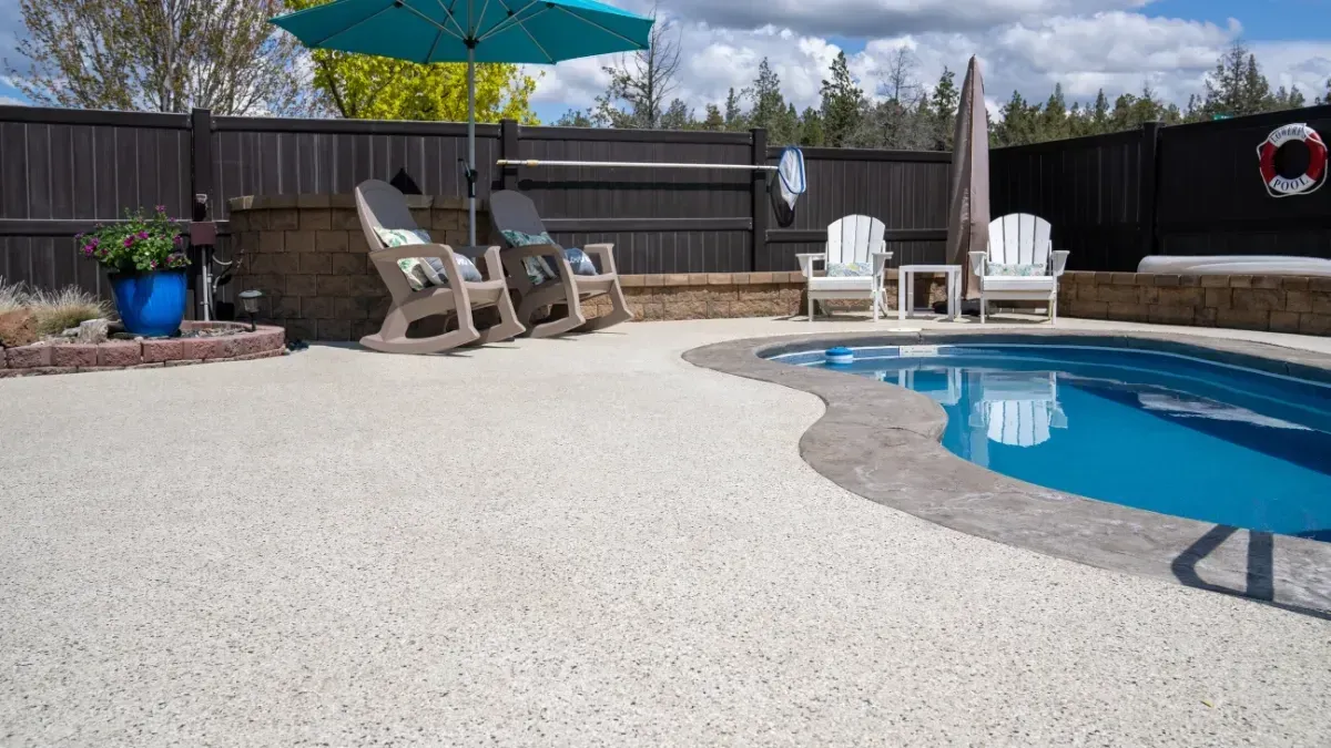 Modern interior with stairs, dark marble wall, and gray stone floor.