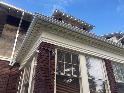 newly painted trim around roof of house