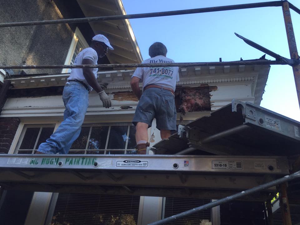 masons at work stnading on scaffolding