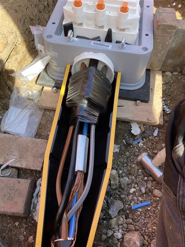 A coffin with a bunch of wires inside of it