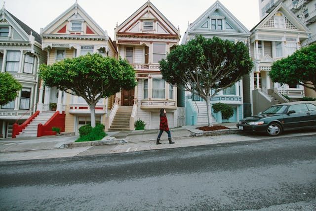 person walking through san francisco neighborhood