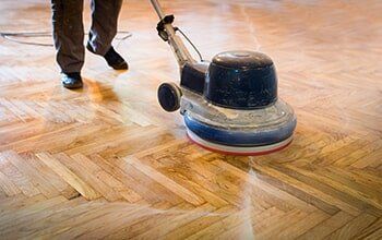 Man Refinishing Floor — Flooring Company in Gaithersburg, MD Man Refinishing Floor — Flooring Company in Gaithersburg, MD