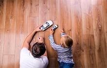 Father & Son Playing On The Floor — Flooring Company in Gaithersburg, MD