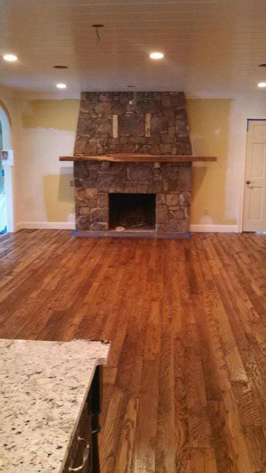 Hardwood Floor In The Fireplace Area — Flooring Company in Gaithersburg, MD