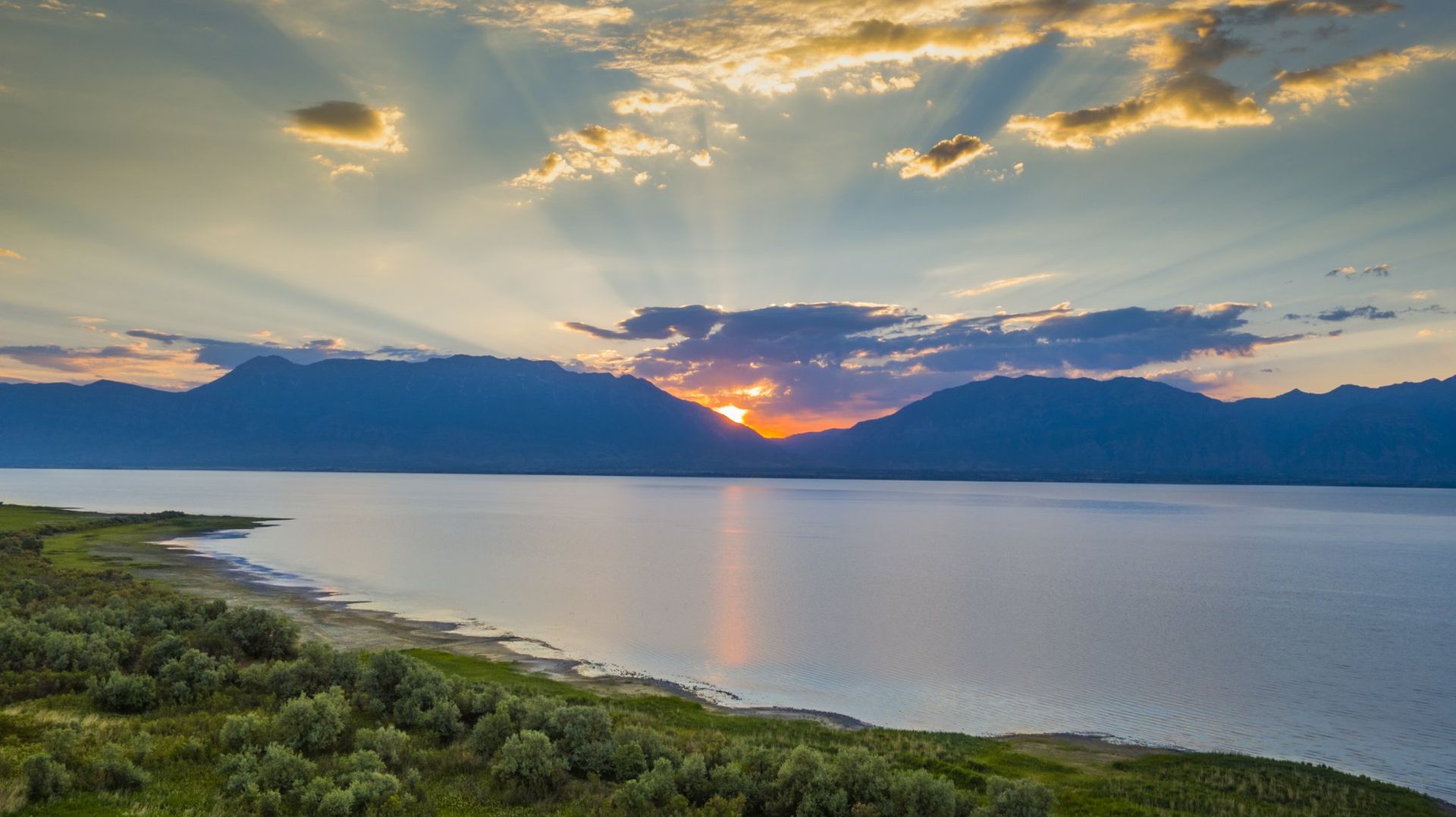 Aerial Drone Photography of Sunrise over Utah Lake with Mt Timpanogos in the background