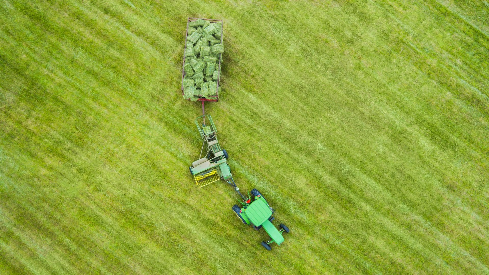 Aerial Drone Photography of Farm Tractor with Hay baler