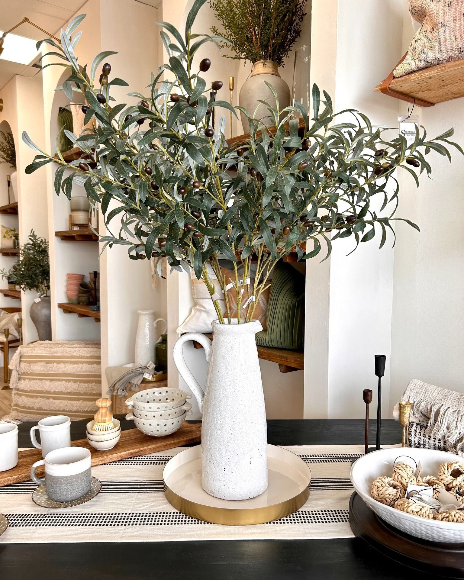 A vase filled with flowers is sitting on a table.