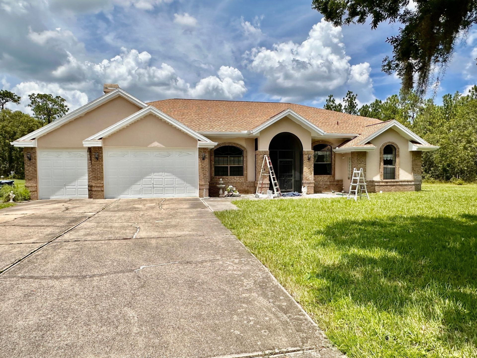 A large house with a ladder in front of it