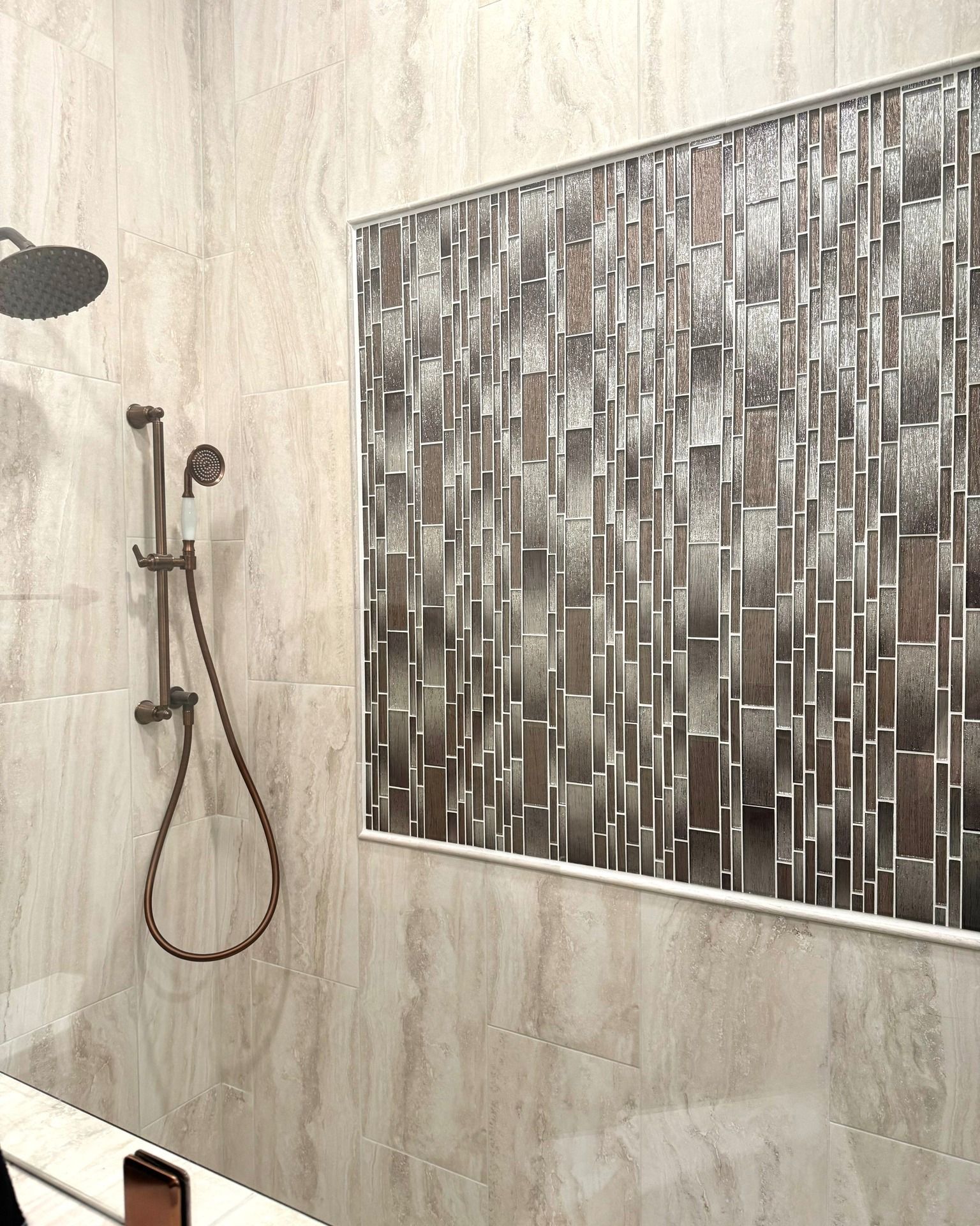 A bathroom with a shower and a picture on the wall.