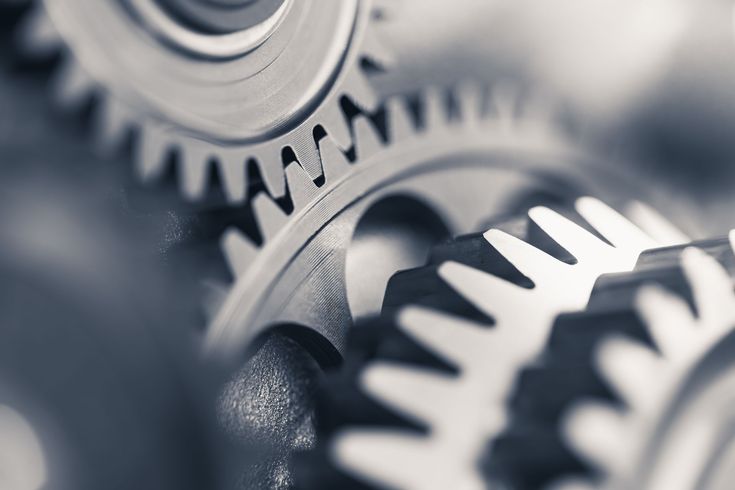A close up of a set of gears on a machine.