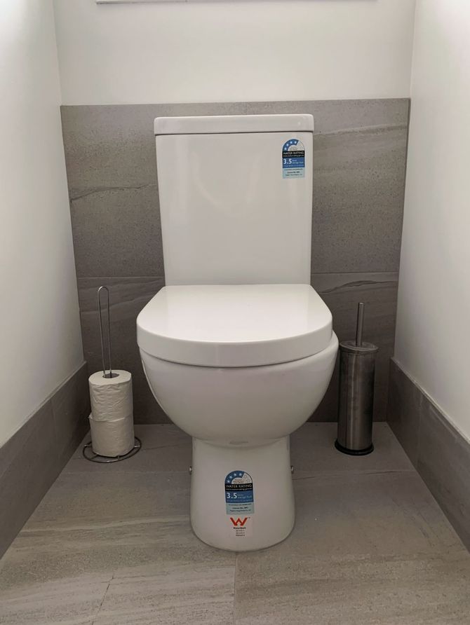 Toilet with Grey Tiles — Richters Joinery in Bundaberg, QLD