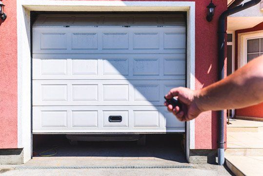 Hand Opening Garage Door PVC Using Remote — Garage Doors Townsville, QLD