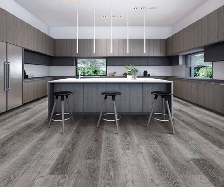 A kitchen with a large island and stools.