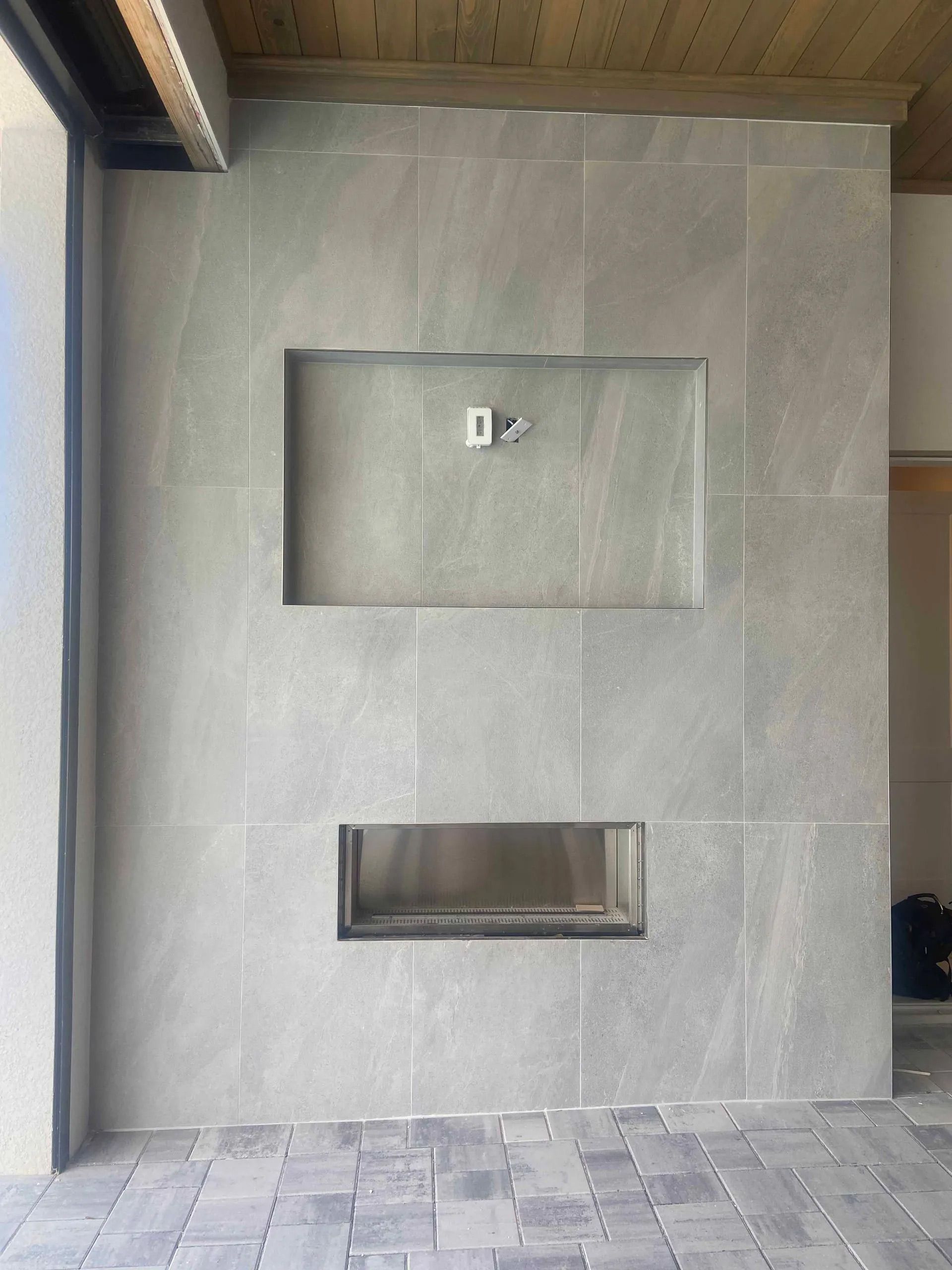 A fireplace is built into a wall in a room.