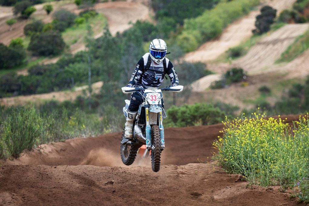 A person is riding a motorcycle on a track.