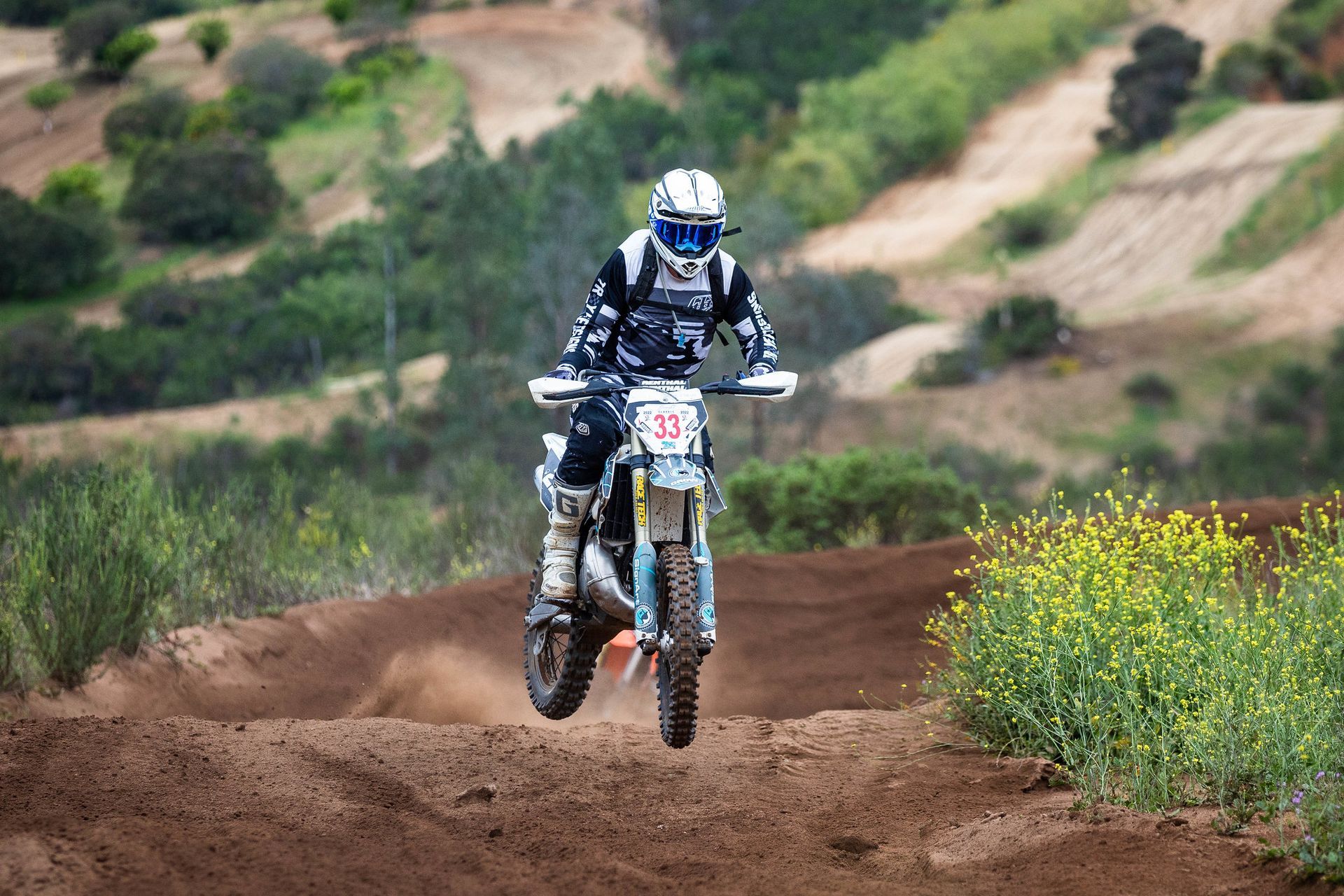 A person is riding a motorcycle on a track.