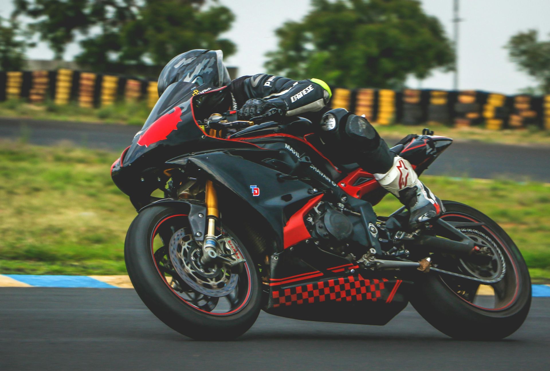 A person is riding a motorcycle on a track.
